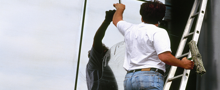 window cleaner on ladders