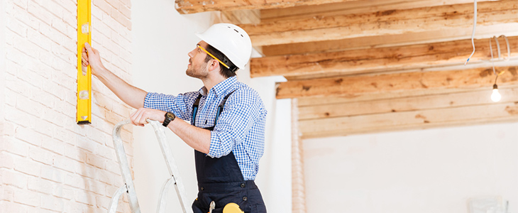 tradesman using step ladders