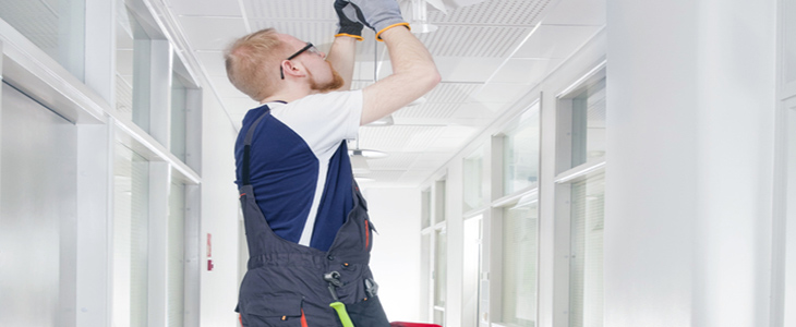 electrician using step ladders